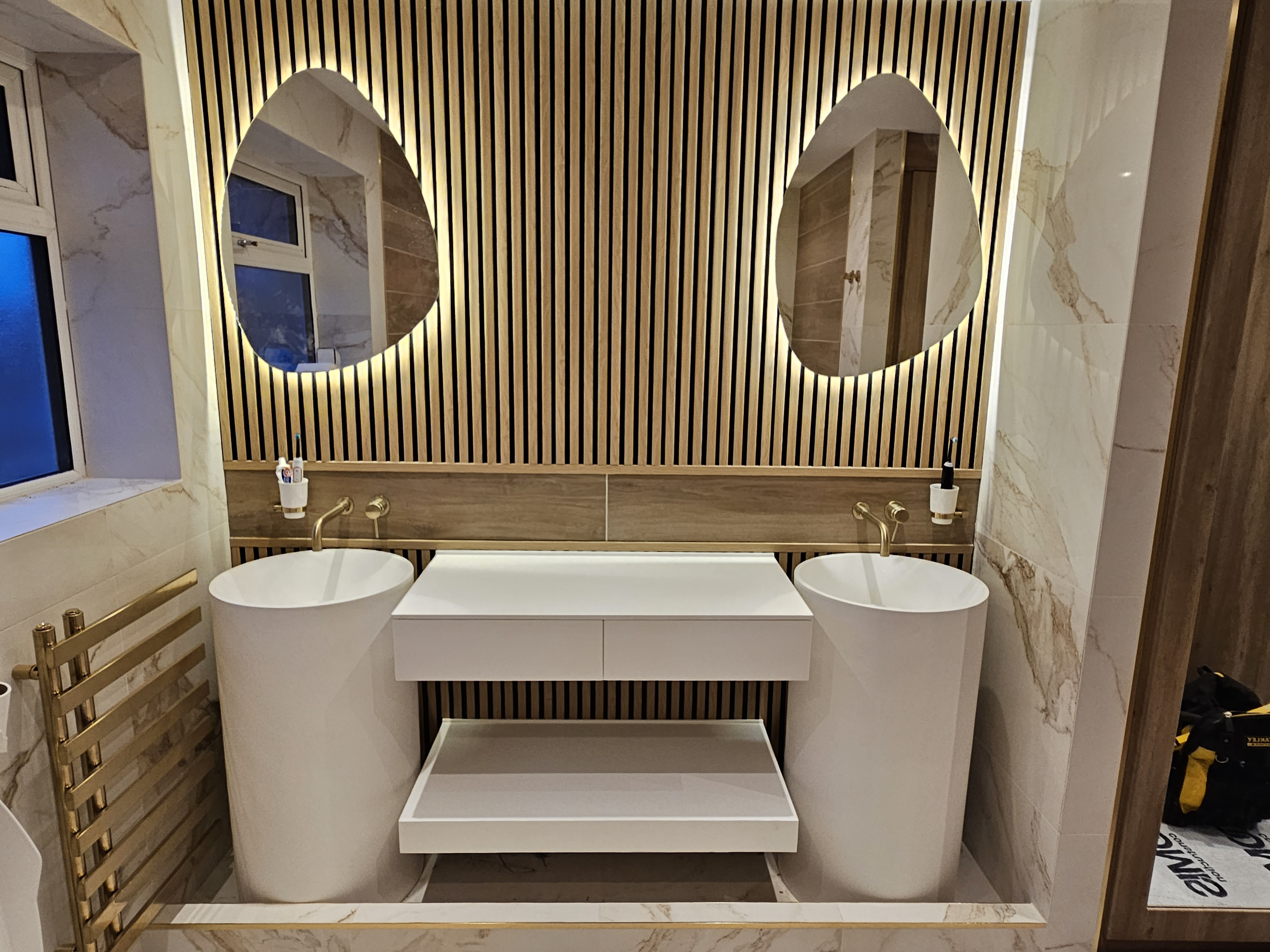 Bespoke twin vanity bathroom with backlit mirrors