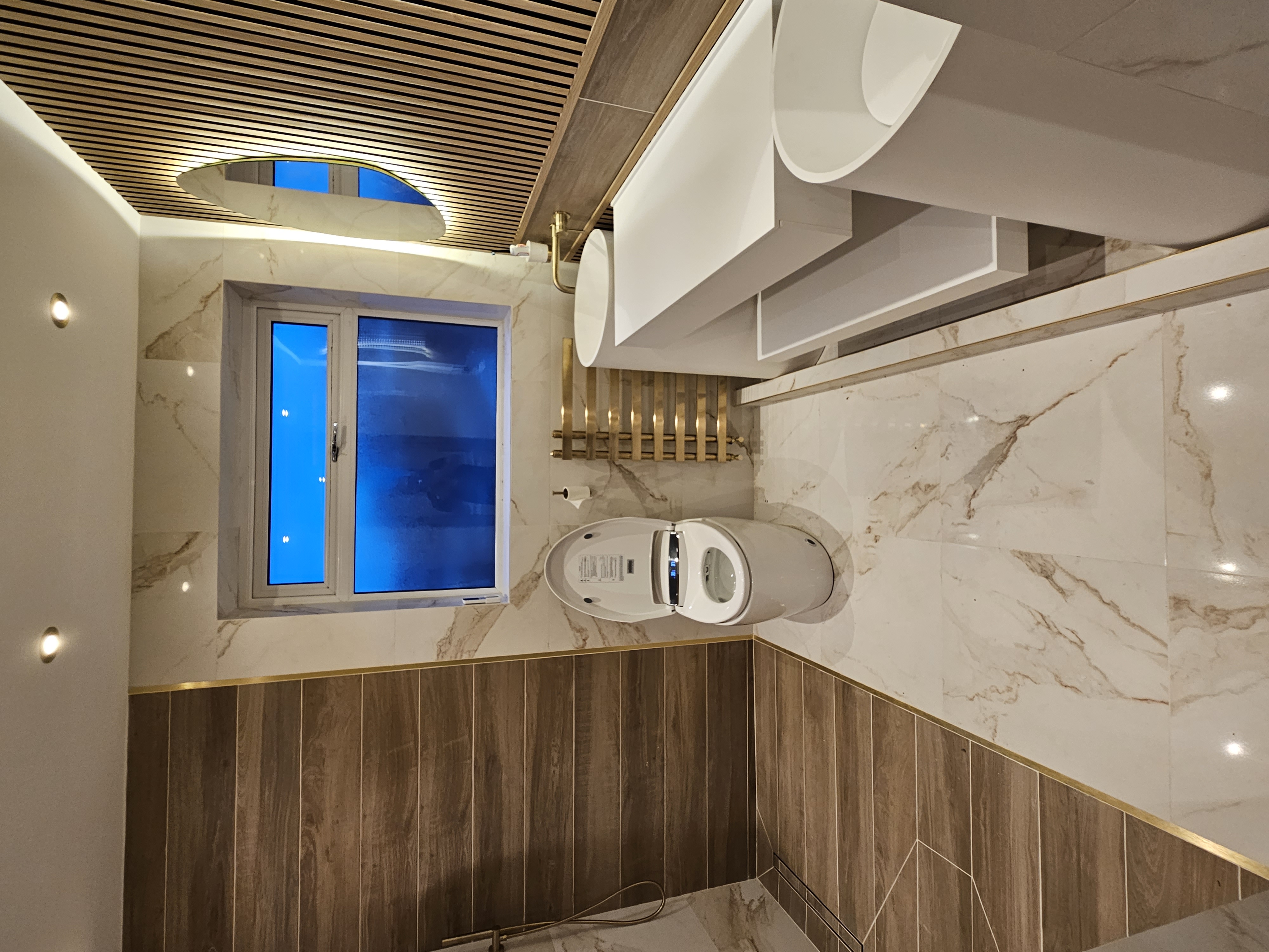 Luxury marble and timber bathroom with integrated walk-in shower area