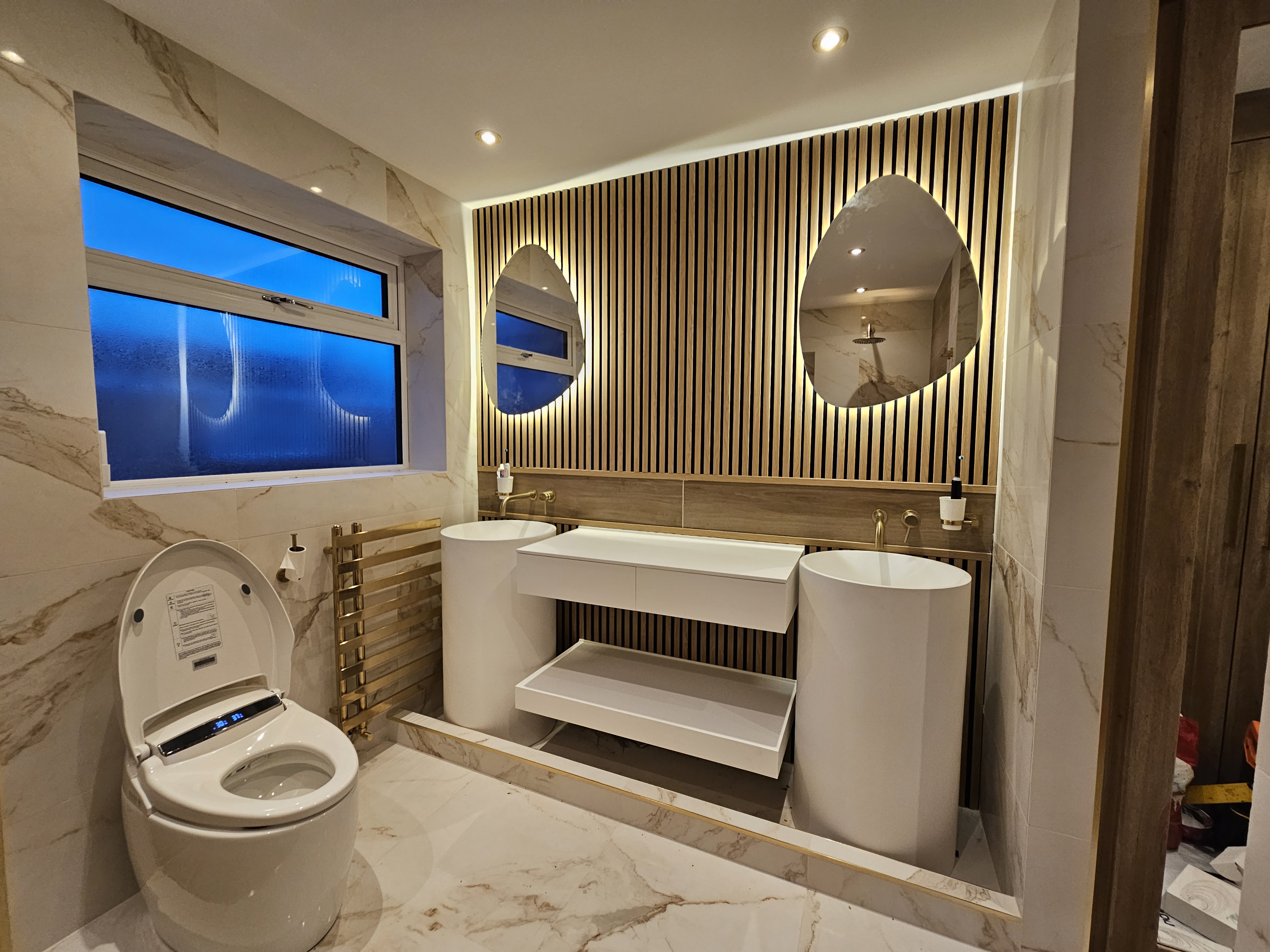 Luxury marble and timber bathroom installed by V&C Mechanical