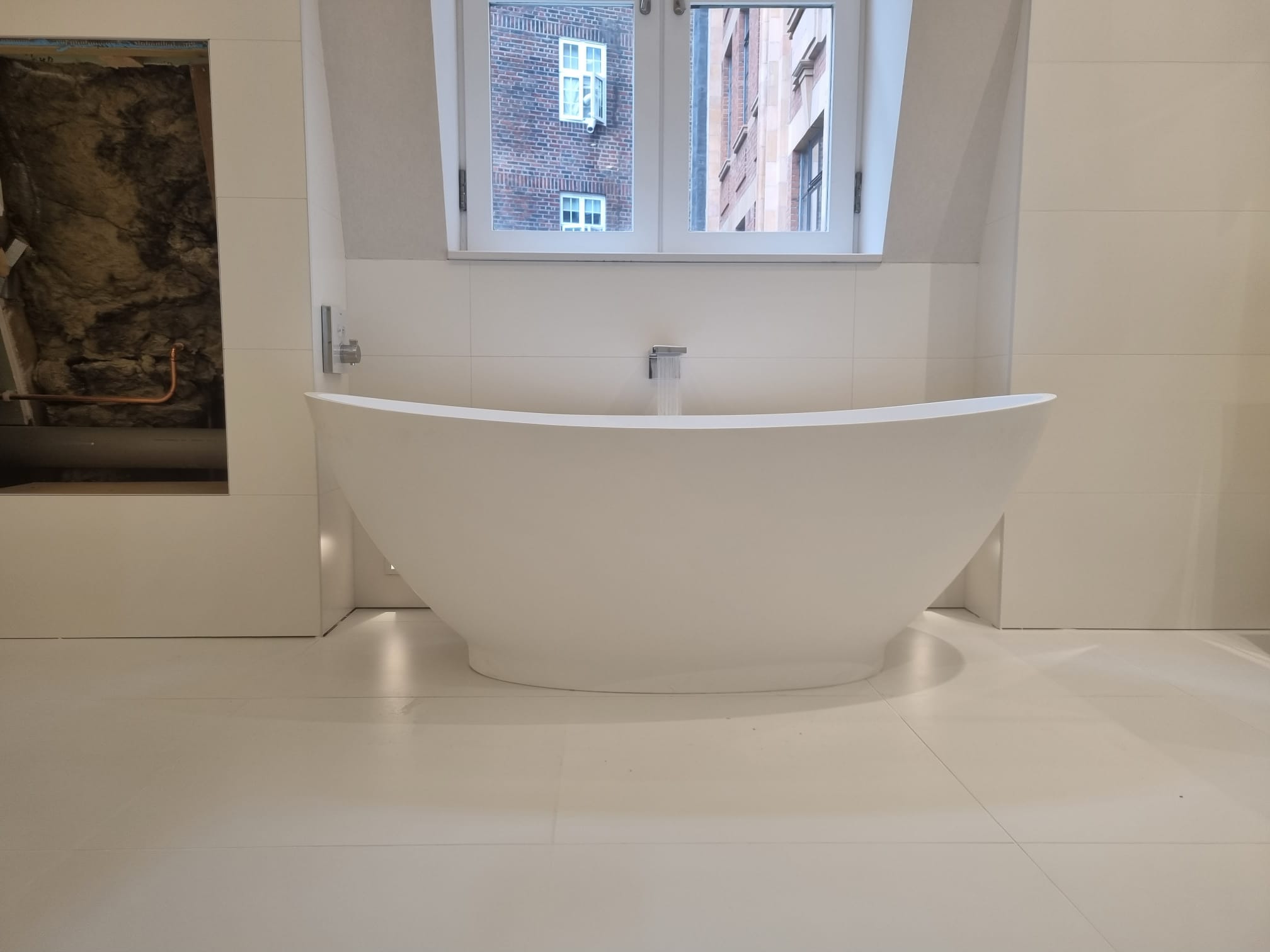 Contemporary white bathroom with freestanding bath