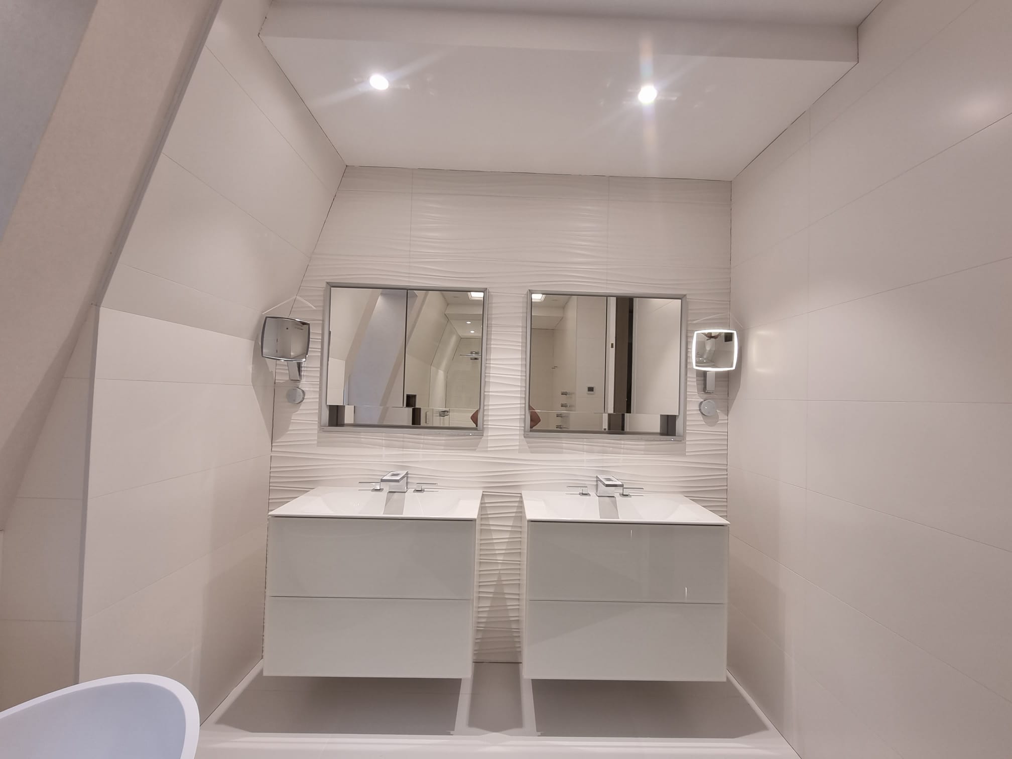 Contemporary twin vanity installation with textured feature tiles
