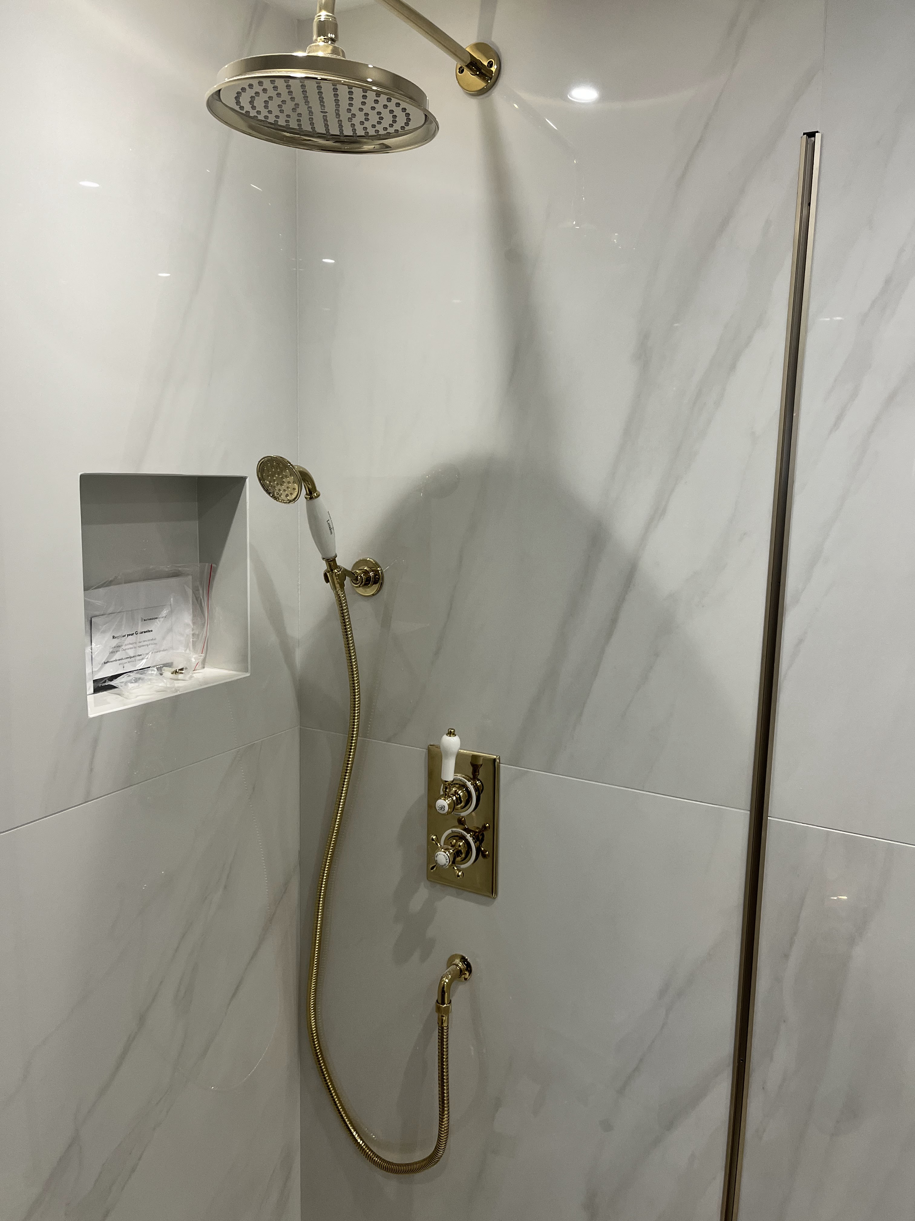 Luxury shower installation with brushed brass fittings