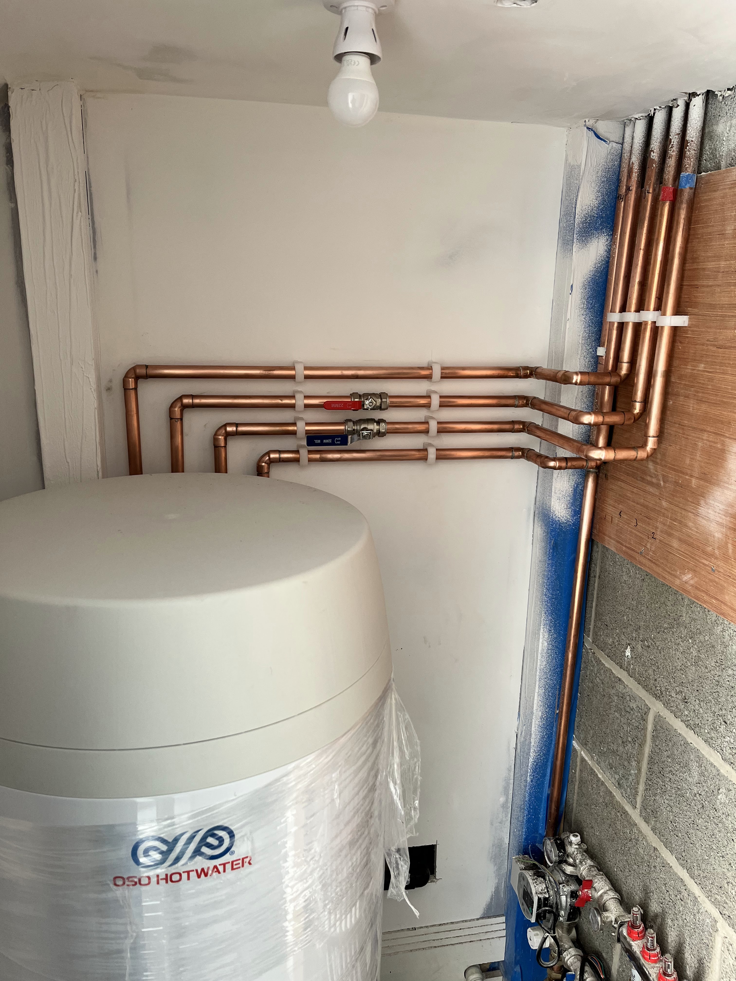 Neatly installed copper pipework and hot water system